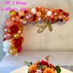 Gold and pink balloon table arch