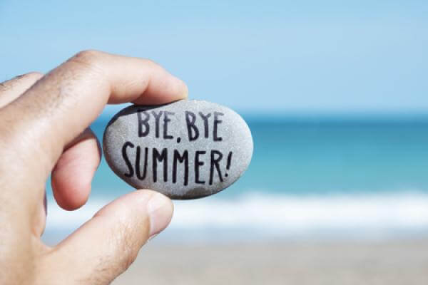 A rock with the words "Bye Bye Summer!" written on it