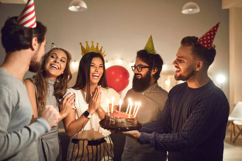 A group of friends enjoying a birthday party